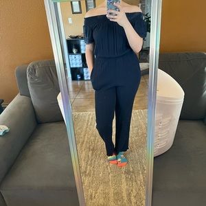 Navy blue jumpsuit with pockets. Can be worn off shoulder or up.